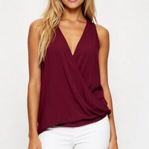 Tart Burgundy Sleeveless Blouse with bubble hem. NWOT. Size L
